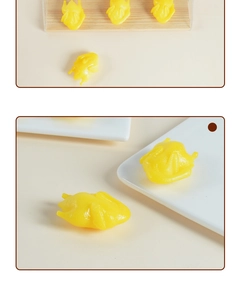 Close-up of realistic PVC mini roasted duck models on a small white plate for dollhouse