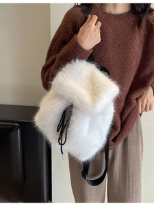 White faux fox fur plush backpack with black drawstring straps for winter autumn