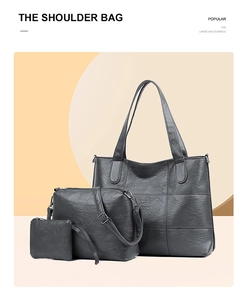 Detailed view of the three-piece black tote bag set including crossbody and coin purse
