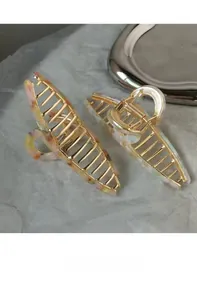 Detail of marble pattern resin hair claws with polished gold-tone metal clips