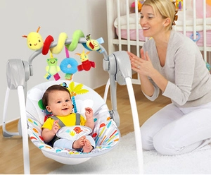 Cozy baby rocker with gray frame and colorful hanging toys in a bright home setting