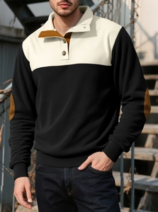 Detail of men's color-block polo sweatshirt with corduroy texture and elbow patches