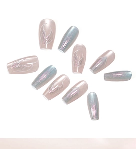 Detailed view of holographic blue and pink press-on nails with artistic pearl finish