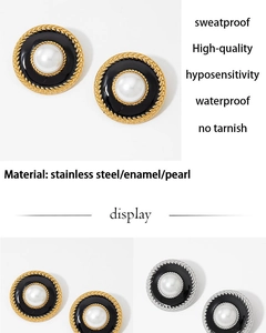 Detail of vintage round enamel earrings with pearl center in gold and silver finish
