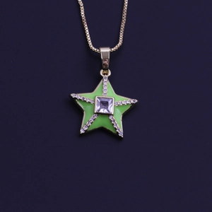 Close-up of gold plated 18k necklace with green enamel star pendant and zircon stones