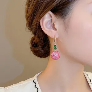 Elegant Neo-Chinese ceramic drop earrings with pink and green beads and gold hooks