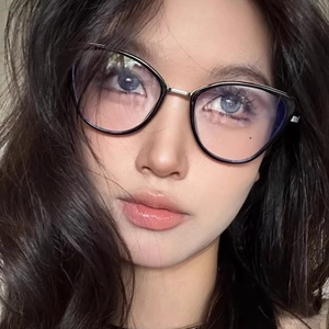 Classic black cat-eye sunglasses with metal frames on model for stylish face-shaping look