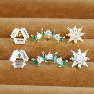 Surgical steel star and floral stud earrings with sparkling green and white zircon stones