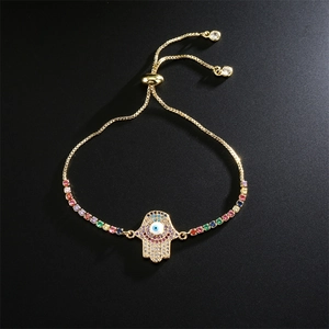 Detailed macro view of Hamsa Hand bracelet with colorful zircons and Evil Eye symbol