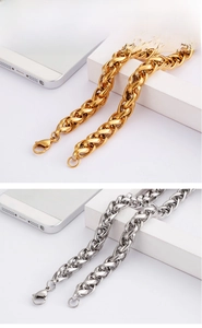 Close-up of heavy industrial style stainless steel woven chains in gold and silver