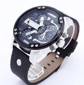 Detail of multi-timezone oversized dial with silver stainless steel case and black leather strap