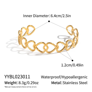 Detail showing dimensions of the 18K gold-plated cutout heart stainless steel bangle