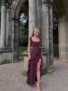 Elegant fuchsia square neck long dress with ruffle details and side slit in outdoor setting