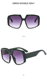 Front and side views of green oversized irregular sunglasses with grey gradient lenses