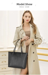 Quilted black tote bag with V-shaped texture shown on model for daily commuting style