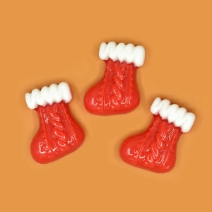 Detailed view of three red Christmas stocking charms with realistic knit texture