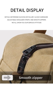 Detail of smooth double metal zippers on khaki canvas bag with high quality texture