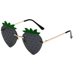 Frameless strawberry shaped sunglasses with dark grey lenses and golden metal frames