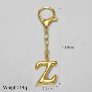 Detailed size view of a polished 18k gold letter Z keychain with spring snap hook