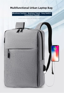 Detail view of water-resistant gray business backpack with external USB charging port