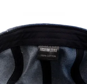 Detail of 100% cotton washed denim hat showing inner care label and stitching quality