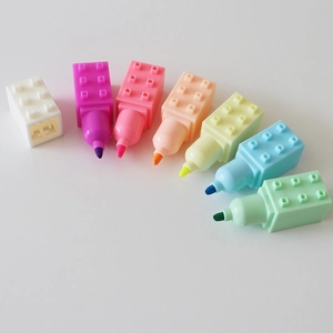 Detailed view of stackable building block highlighters in seven vibrant colors