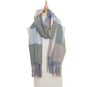 Close-up of thick plaid scarf featuring soft cashmere-like texture and fringed edges