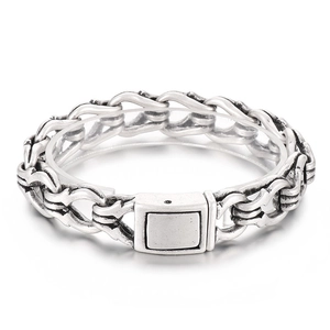 Retro punk interlocking handcuffs bracelet in silver stainless steel on white background