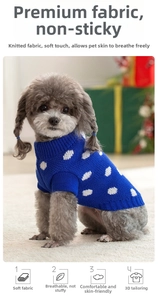 Detail of navy blue knitted dog sweater with white polka dots and cozy high neck design