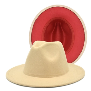 Detail of khaki wool felt fedora featuring a contrast red lining and wide brim style