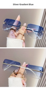 Close-up of rimless gradient blue sunglasses with silver frames and butterfly diamond accents