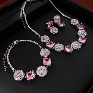 Pink gemstone and silver rose jewelry set including necklace, bracelet and earrings