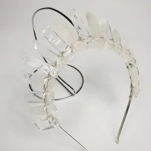 Detailed view of handmade crystal crown headband with silver wire wrapping on metal base