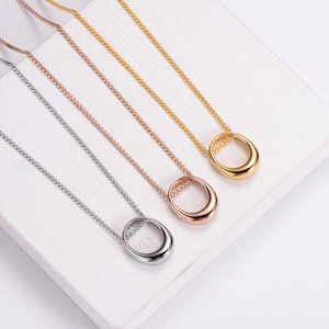 Minimalist metallic collar necklaces in gold, rose gold and silver on stone base