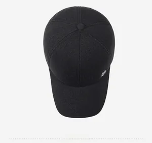 Top view of thick wool blend winter hat for men featuring a metallic shield logo detail