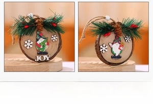 Close-up of wooden Christmas gnome ornaments with pine needles and JOY NOEL lettering