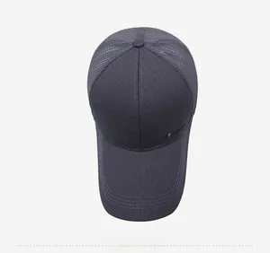 Top view of dark grey baseball cap featuring breathable mesh panels and fashion label