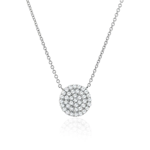 Macro detail of silver-tone circular pendant with pavé-set shimmering cubic zirconia