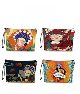 Detail view of four Chinese style mermaid print cosmetic bags with zippers and hand straps
