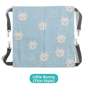 Close-up of thin light blue cat hammock featuring white rabbit patterns and metal hooks