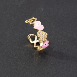 Detail of pink enamel evil eye heart ring with sparkling white cubic zirconia stones