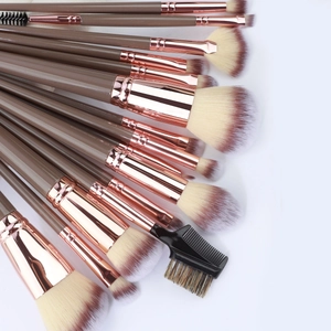 Detailed view of 15pcs makeup brush set with rose gold ferrules and brown handles