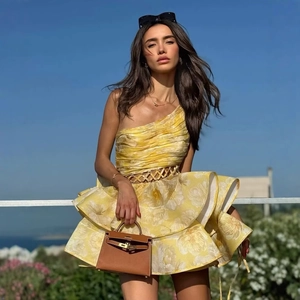 One-shoulder yellow floral pleated dress with waist cutout for a sexy summer style