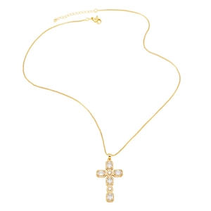 Macro detail of golden cross necklace with crystal zircon stones and adjustable chain