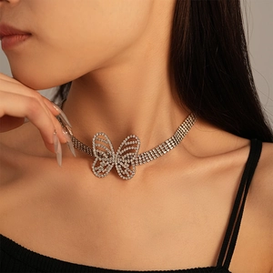 Elegant silver butterfly choker necklace with rhinestones worn on neck by a model