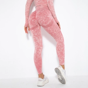 Close-up of pink acid wash yoga leggings with scrunch butt and breathable mesh details