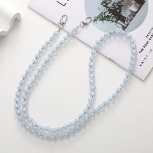 Detail of light blue transparent acrylic bead phone chain with silver metal spring clasps