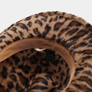 Detailed macro view of plush leopard print cowboy hat interior with adjustable strap