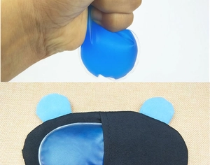 Detail showing hand-squeezing blue gel cooling pad for durability and eye mask insertion