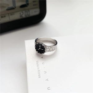 Minimalist silver watch-style ring with black dial and embossed link texture
